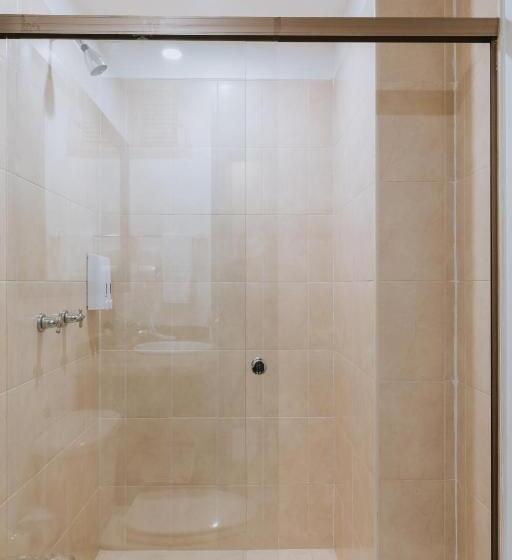 Отель Travelers Orange Suites