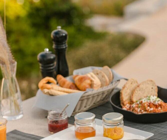 Отель Ariá Estate Suites & Spa