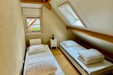 ツーリストアパートメント Huisje Aan De Bosrand Veluwe