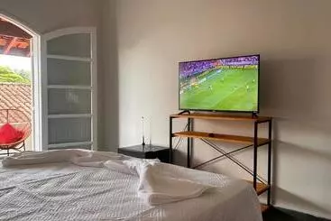 تختخواب و صبحانه Suítes Aqui é Seu Lugar Itaguá