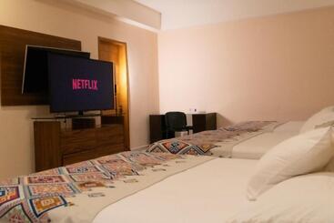 Apart Hotel Infinity Suites Habitación Triple 211