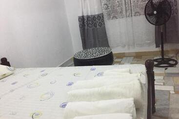 Пансион Comfy Beachside Condo