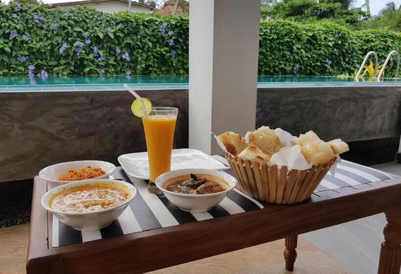 تختخواب و صبحانه Athithi Villa