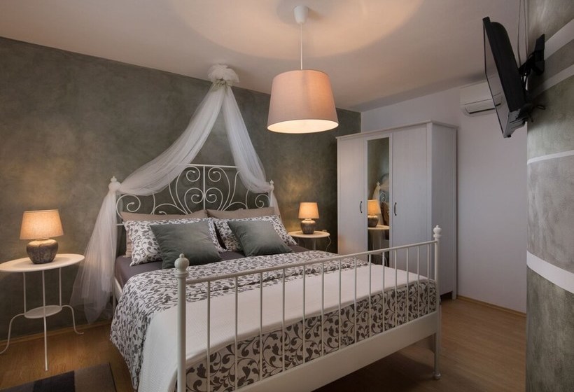 Surrounded By Beautiful Mediterranean Vegetation And The Crystal Clear Sea