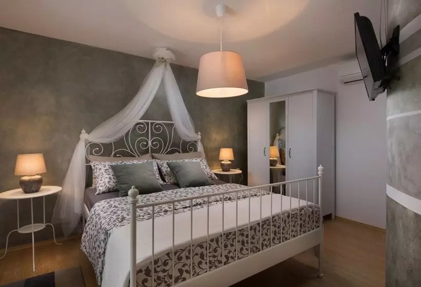 Surrounded By Beautiful Mediterranean Vegetation And The Crystal Clear Sea