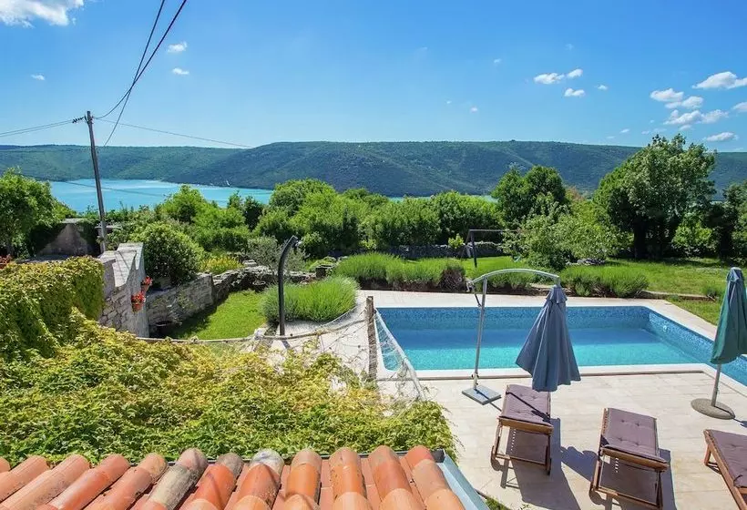 Surrounded By Beautiful Mediterranean Vegetation And The Crystal Clear Sea