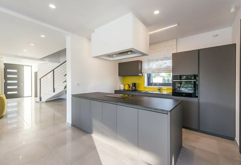 A Modern Luxury Villa With A Crystalclear Swimming Pool And Cultivated Garden