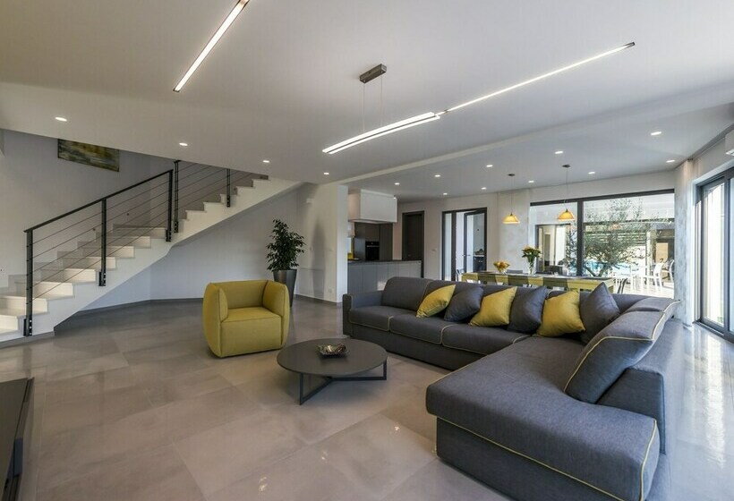 A Modern Luxury Villa With A Crystalclear Swimming Pool And Cultivated Garden