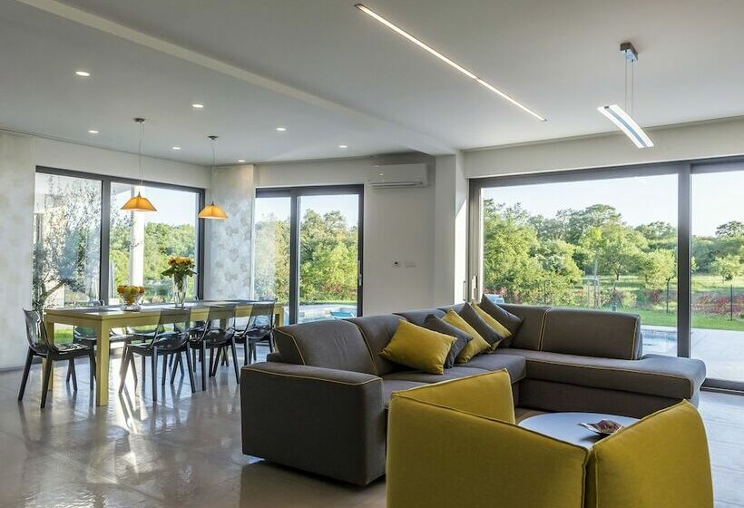 A Modern Luxury Villa With A Crystalclear Swimming Pool And Cultivated Garden