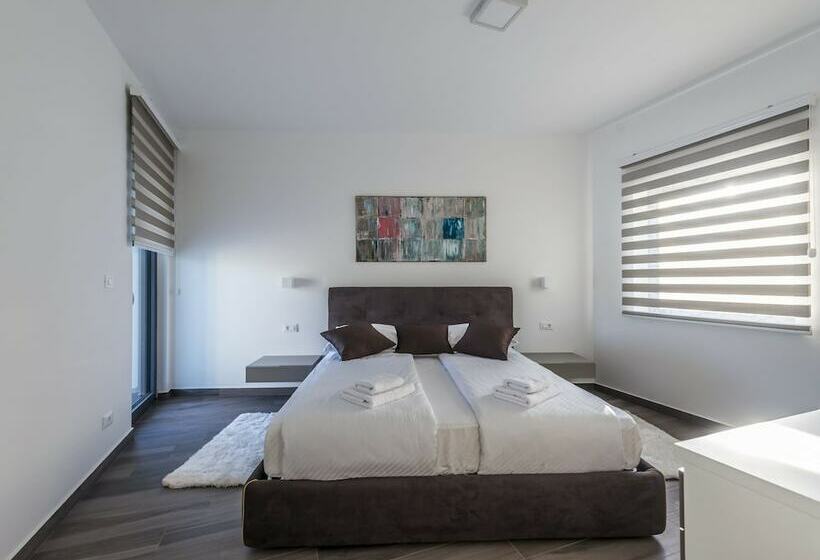 A Modern Luxury Villa With A Crystalclear Swimming Pool And Cultivated Garden