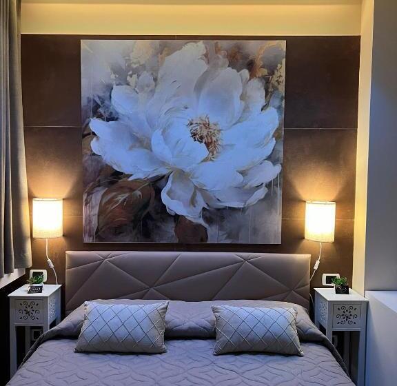 تختخواب و صبحانه La Dea Bendata