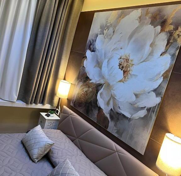 تختخواب و صبحانه La Dea Bendata