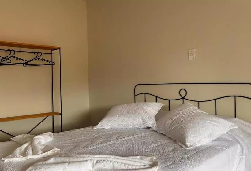 تختخواب و صبحانه Suítes Aqui é Seu Lugar Itaguá