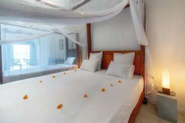 بنسيون Blue Parrot Beach Villa