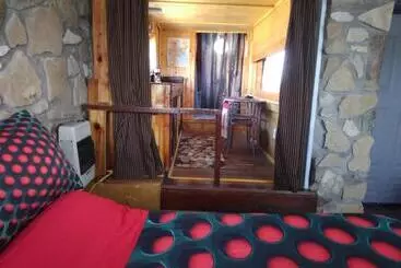 Pension La Loma Del Chivo Llc Stone Cottage Alternative Building