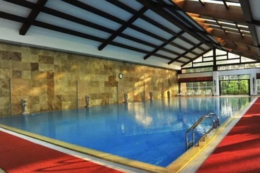 Отель New Century Resort & Spa Puer