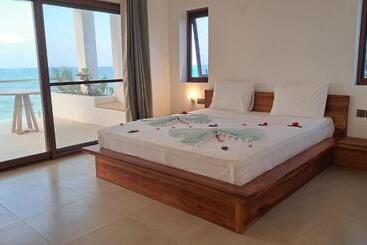 Отель Aluna Beach Apartments