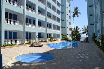 Cowrie Shell Beach Apartments Official