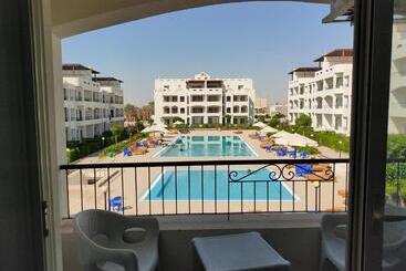 هتل آپارتمان شالية قرية بالميرا اطلالة مسبح