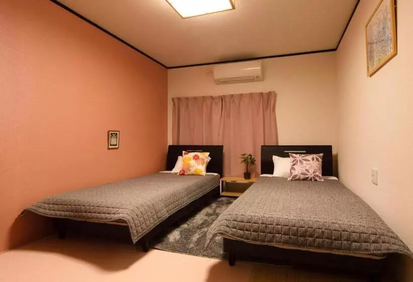 ペンション Guest House Suzumeno Kakurembo