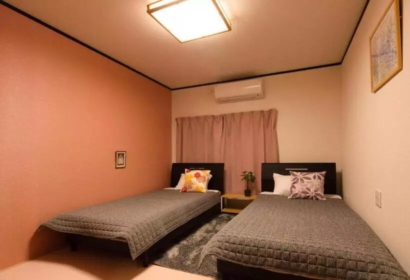 ペンション Guest House Suzumeno Kakurembo