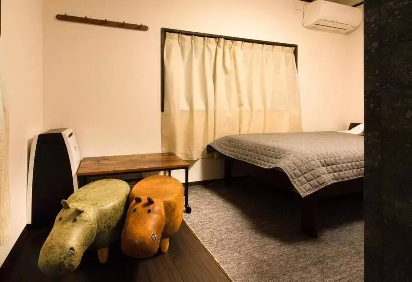 ペンション Guest House Suzumeno Kakurembo