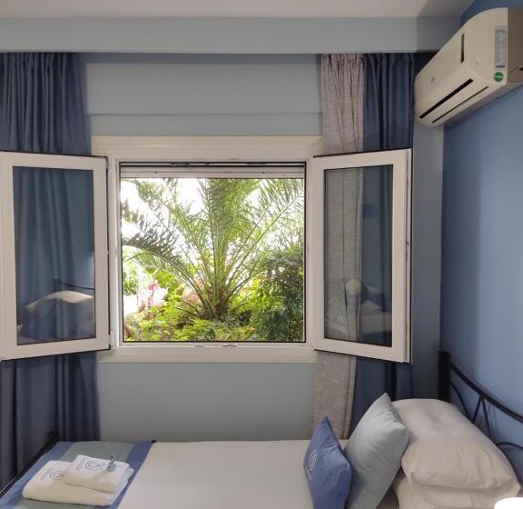 Отель Celeste Deluxe Apartments