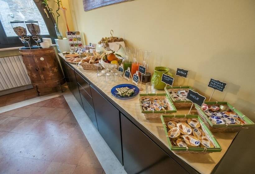 تختخواب و صبحانه R&b Un Mondo A Colori