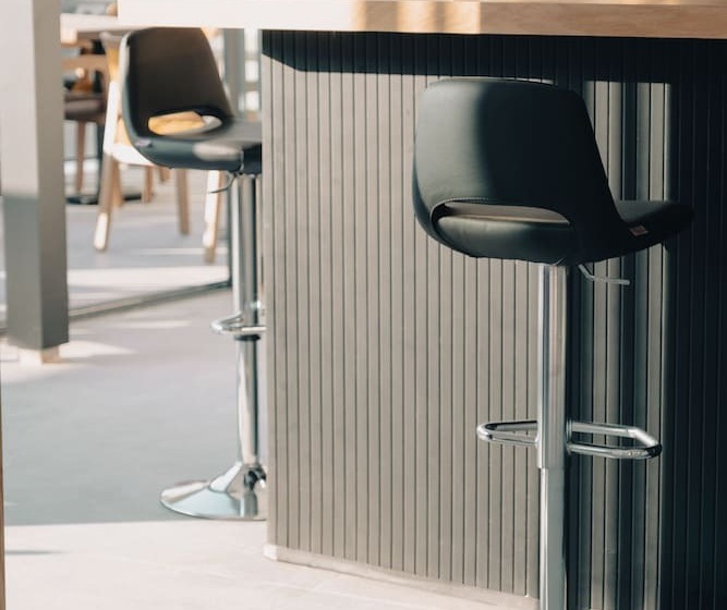 Отель The Ivy Suites