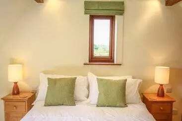 Mökkimajoitus The Coach House