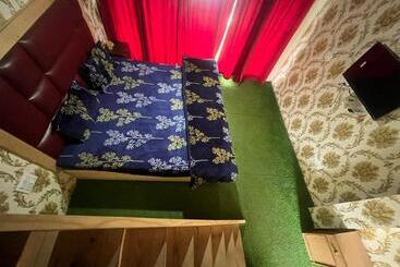 בית מלון כפרי Dak Bangla Cottages