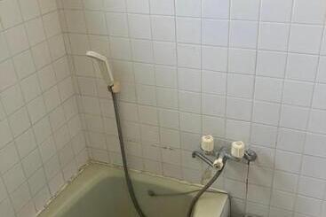 Pensjonat 与論ゲストハウス ズッ友荘