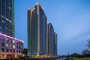 호텔 Ramada Encore By Wyndham Yangzhoudong Railway Station