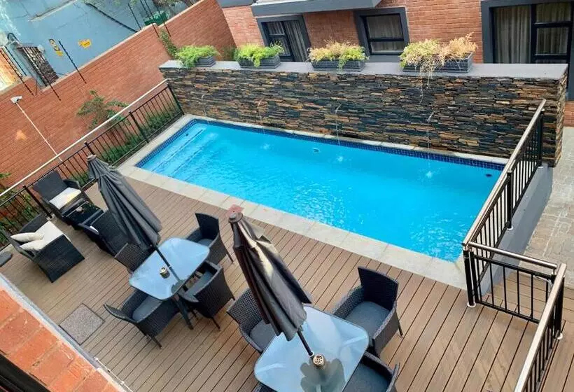 Отель At Hatfield Apartments