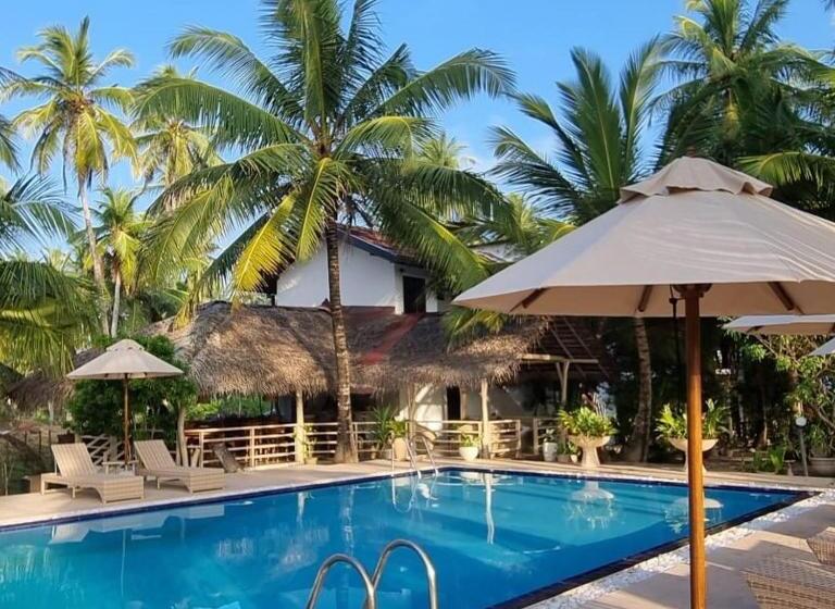 בית מלון כפרי Golden Beach Paradise