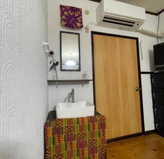 بنسيون 与論ゲストハウス ズッ友荘