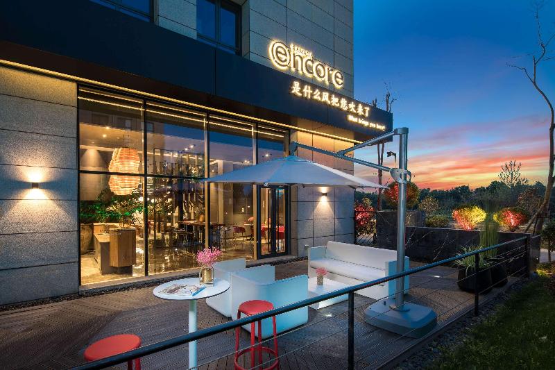 호텔 Ramada Encore By Wyndham Yangzhoudong Railway Station