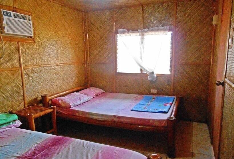 פנסיון Mar And Em's Bamboo Cottages