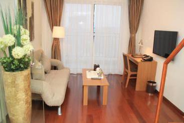 アパートホテル Thumb Plaza Apartel Qingdao Sunland