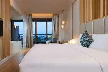 בית מלון כפרי Thousand Cranes Sanya Yazhou Bay Int L Exchange Centre