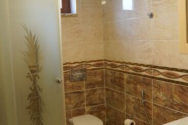 Lägenhetshotell Ozbek Suit