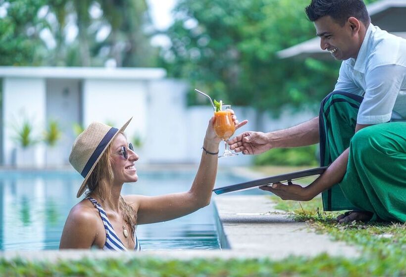 Отель Calamansi Cove Villas