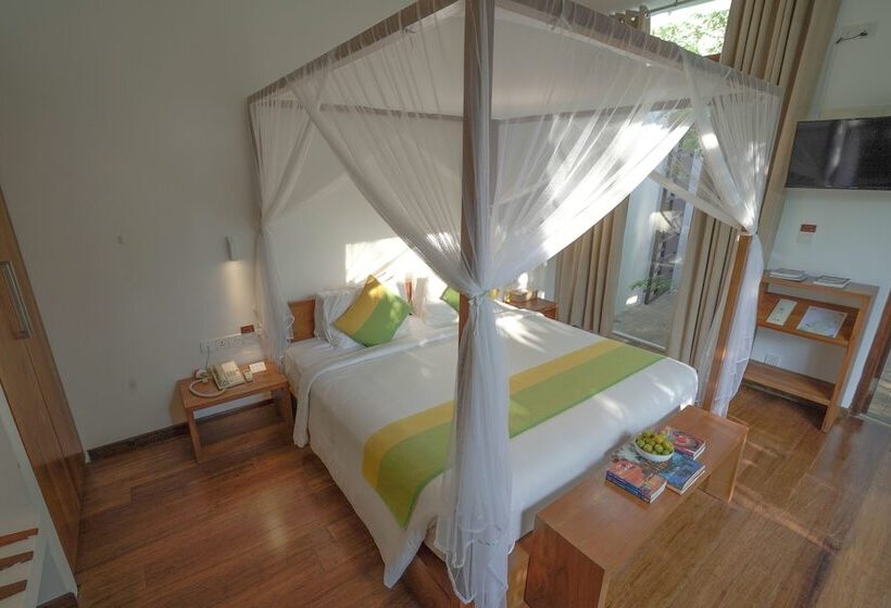 Отель Calamansi Cove Villas