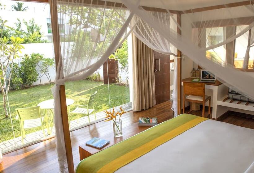 Отель Calamansi Cove Villas