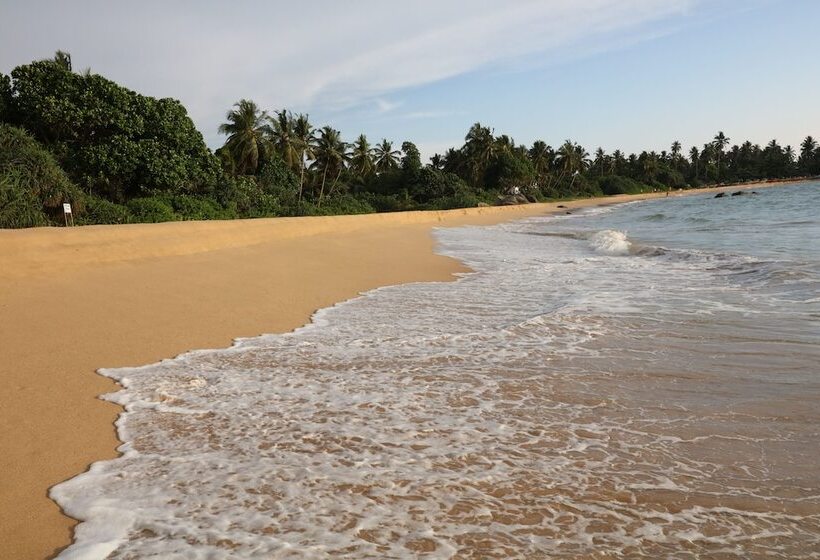 Отель Calamansi Cove Villas