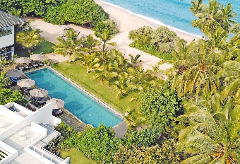 Отель Calamansi Cove Villas