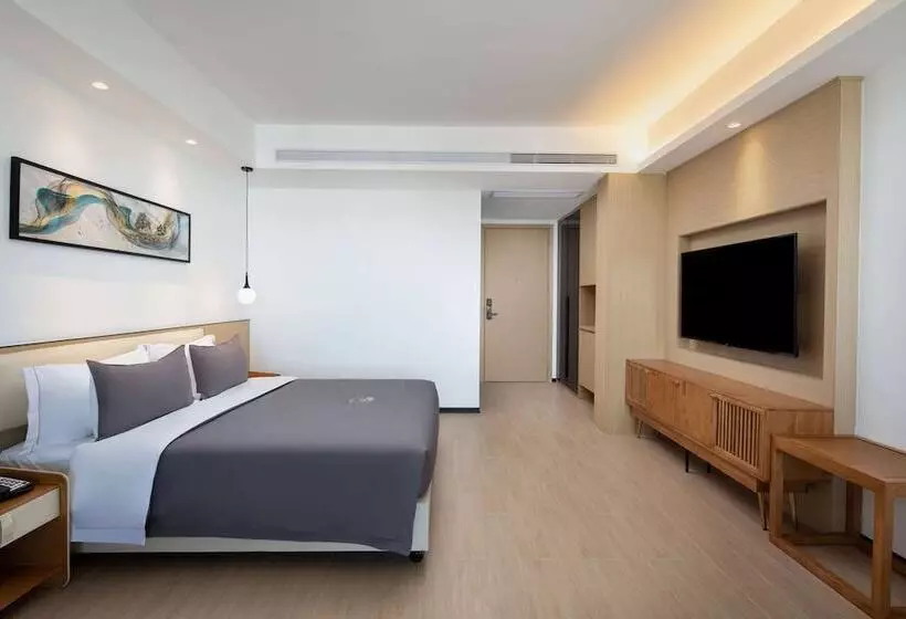 ホテル Ramada Encore By Wyndham Jiusuo Downtown