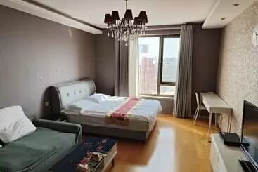 Hotelli Beijing Yilejia Apartment