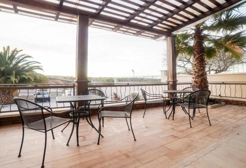 Отель Capital O Descanso Inn