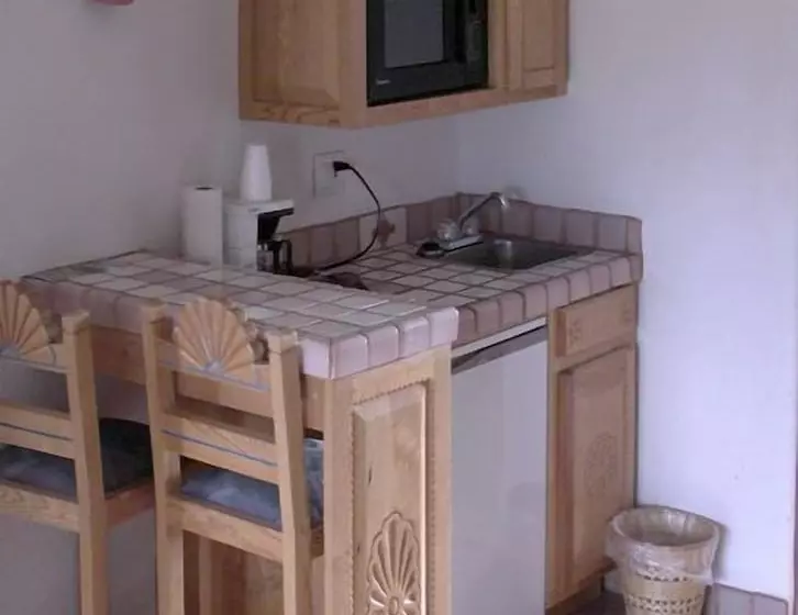 Отель Sun God Lodge